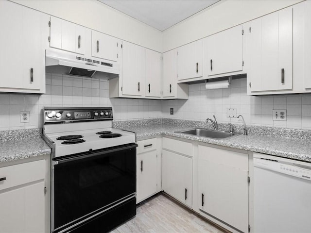 kitchen featuring electric stove, backsplash, white dishwasher, under cabinet range hood, and a sink