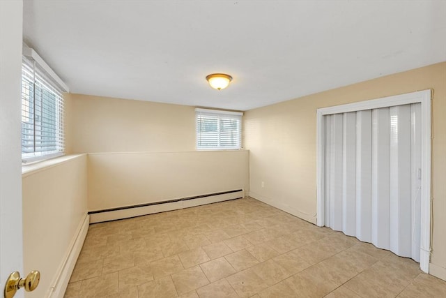 unfurnished bedroom with a closet and a baseboard radiator