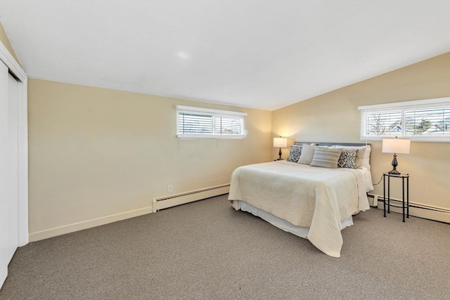 bedroom with a baseboard heating unit, carpet flooring, vaulted ceiling, and baseboards