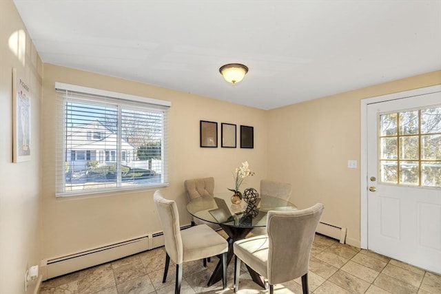 dining room featuring baseboard heating