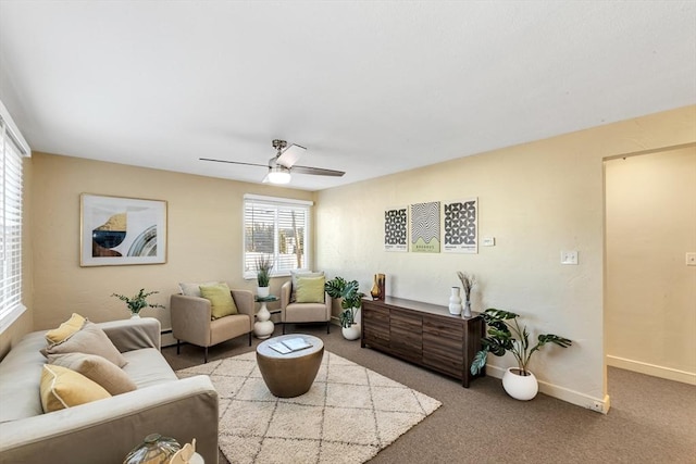 living room featuring a ceiling fan, carpet, a baseboard radiator, and baseboards