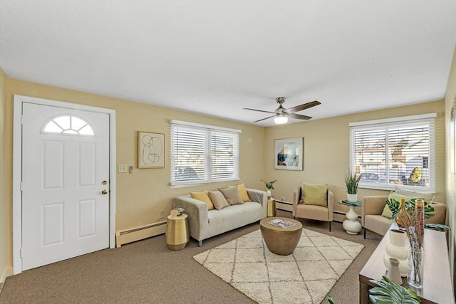 living room featuring carpet floors, ceiling fan, and baseboard heating