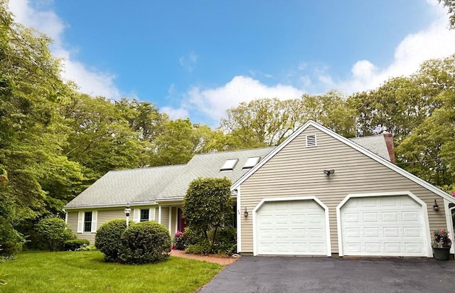 160 Coachman Ln, Barnstable, MA 02668 - view of front of property featuring driveway, a garage, a chimney, a front lawn, and a shingled roof