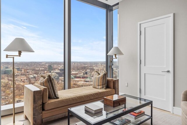 interior space featuring light wood-type flooring and expansive windows