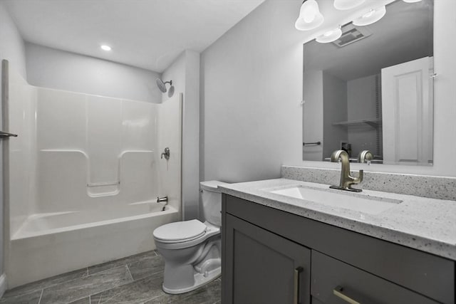 full bathroom with vanity, toilet, and shower / washtub combination