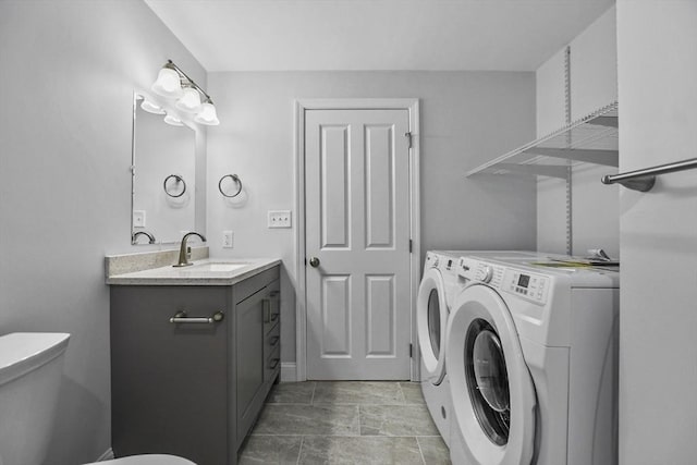 laundry room featuring independent washer and dryer and sink