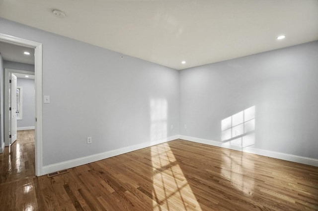 unfurnished room featuring wood-type flooring