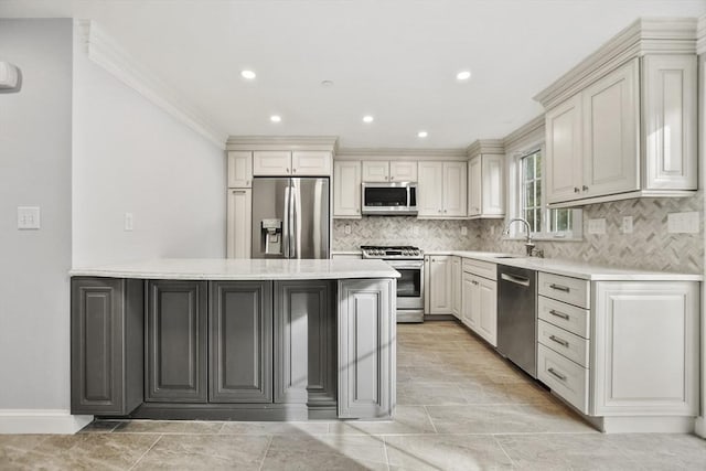 kitchen featuring light stone countertops, appliances with stainless steel finishes, backsplash, ornamental molding, and sink