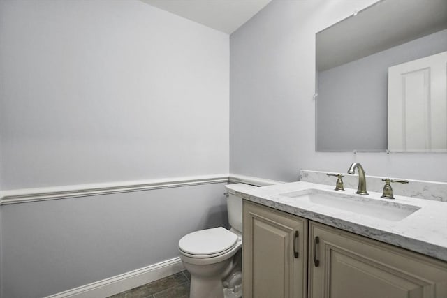 bathroom with tile patterned floors, vanity, and toilet