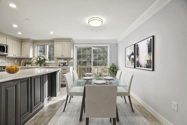 dining space with crown molding