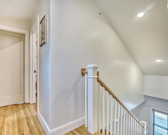 stairs featuring recessed lighting, wood finished floors, and baseboards