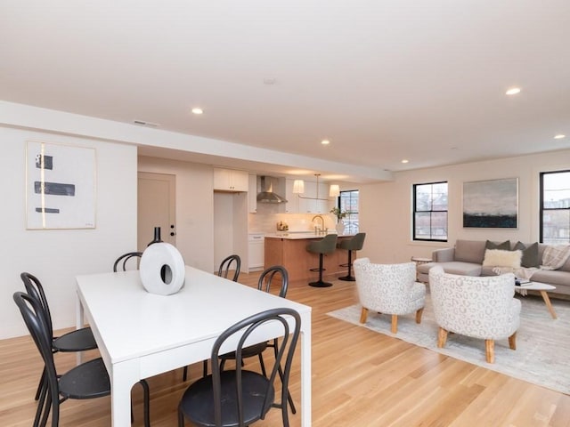 dining room featuring recessed lighting and light wood finished floors