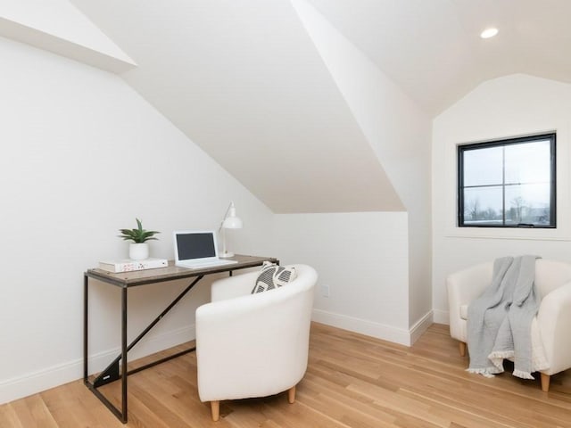 office space with recessed lighting, light wood-style flooring, baseboards, and vaulted ceiling