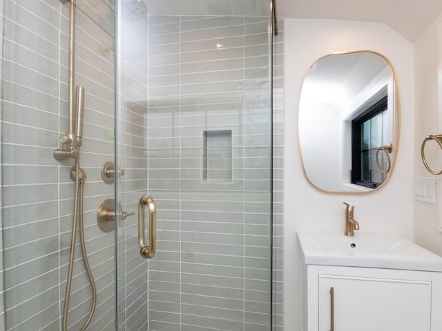 bathroom featuring vanity and a stall shower