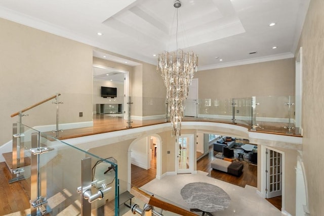 69 Princeton Rd, Brookline, MA 02467 - dining room with wood finished floors, arched walkways, recessed lighting, ornamental molding, and a chandelier