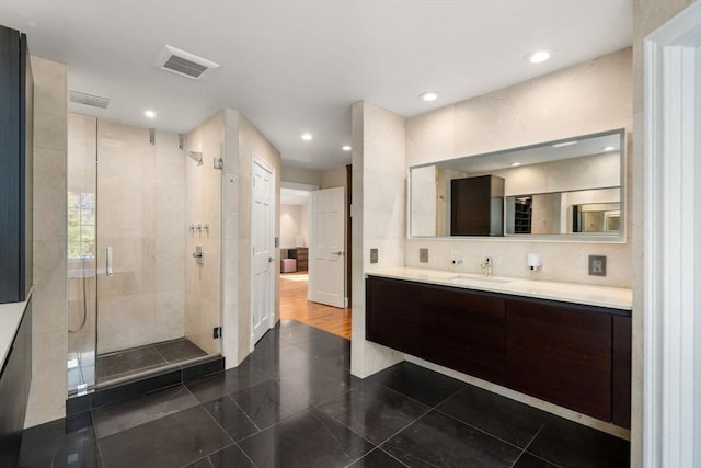 69 Princeton Rd, Brookline, MA 02467 - full bathroom featuring vanity, a shower stall, recessed lighting, and tasteful backsplash