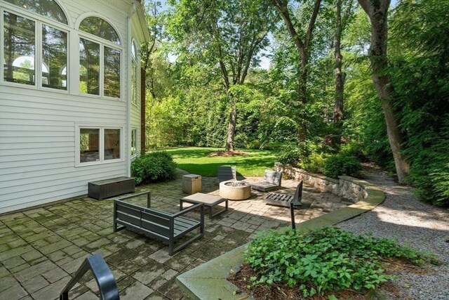 69 Princeton Rd, Brookline, MA 02467 - view of patio with an outdoor living space with a fire pit