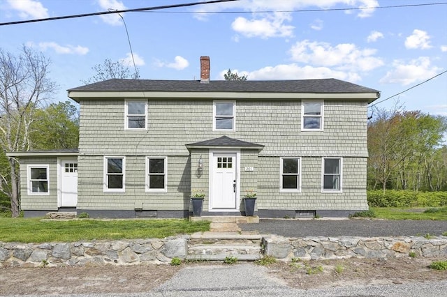 view of front of house with a chimney