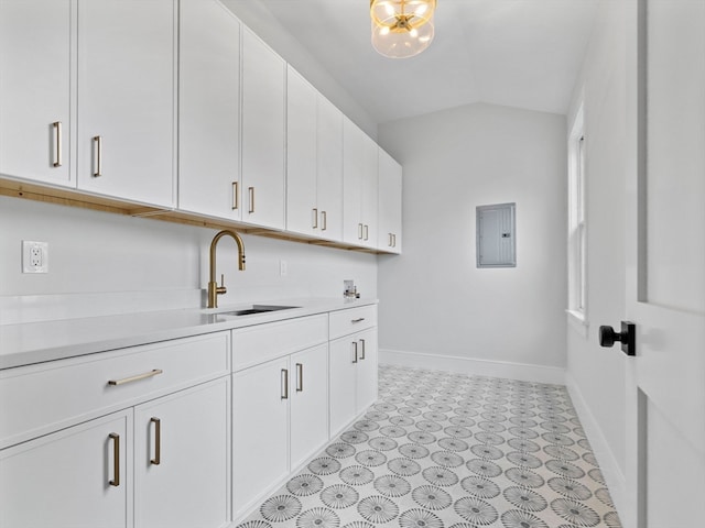 washroom featuring sink and electric panel