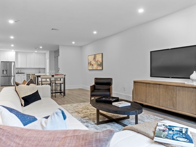 living room featuring light wood-type flooring