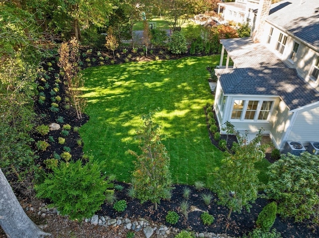 view of yard featuring central AC unit