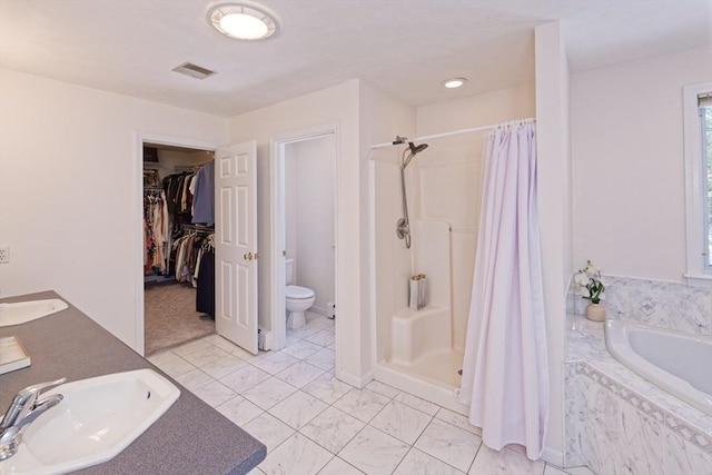 full bathroom with vanity, independent shower and bath, and toilet