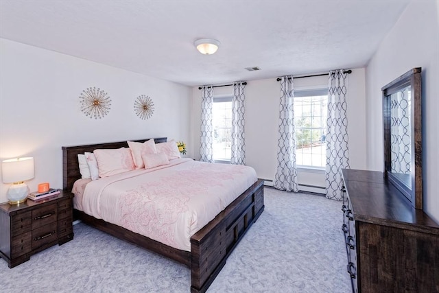 bedroom featuring light carpet