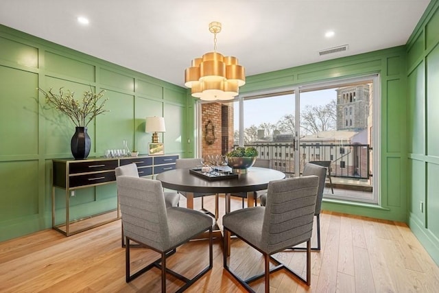 130 Mount Auburn St Unit 310, Cambridge, MA 02138 - dining area with a decorative wall, light wood-style flooring, a chandelier, and recessed lighting