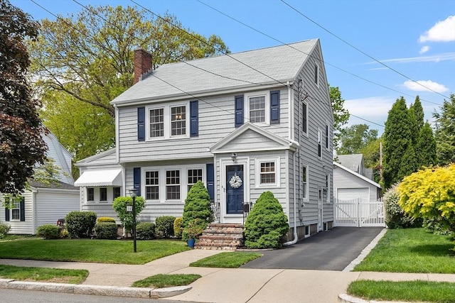 14 Glendale Ave, Melrose, MA 02176 - colonial-style house with a chimney, a garage, and a gate
