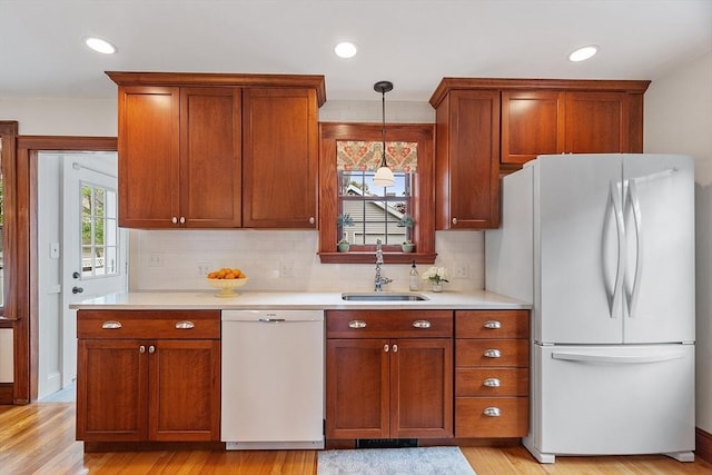 14 Glendale Ave, Melrose, MA 02176 - kitchen featuring white appliances, a sink, light countertops, backsplash, and recessed lighting