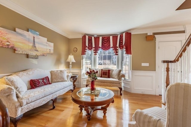 living room with hardwood / wood-style flooring and ornamental molding