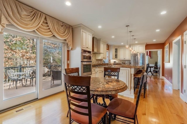 dining area featuring light hardwood / wood-style floors