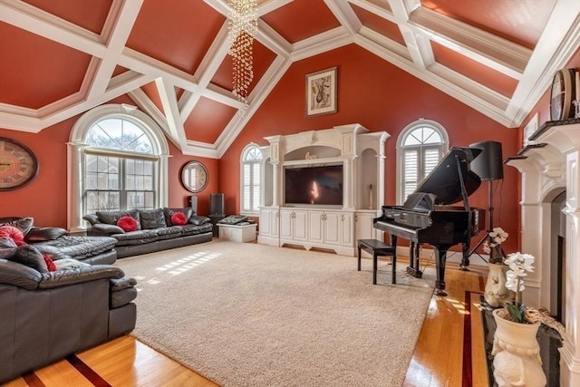 living room with a towering ceiling, hardwood / wood-style flooring, crown molding, and coffered ceiling