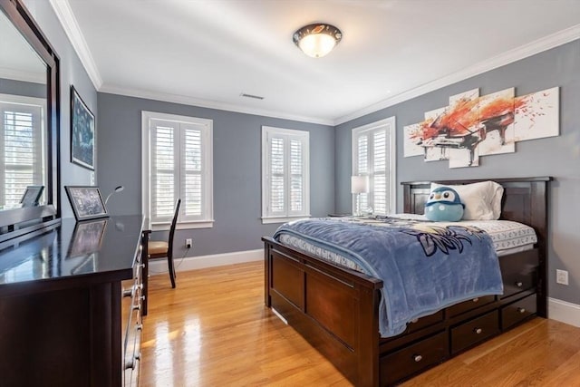 bedroom with light hardwood / wood-style flooring and ornamental molding