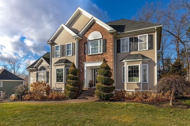 view of property featuring a front yard