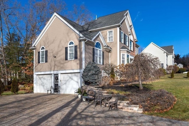 view of side of property featuring a garage