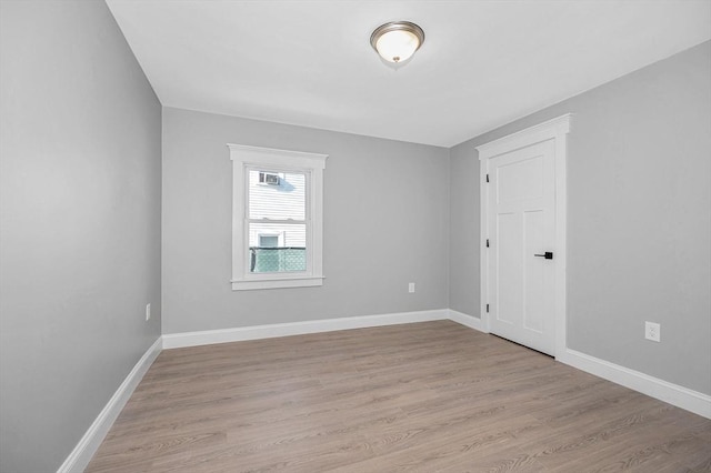 spare room with light wood-type flooring