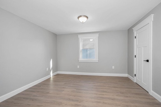 spare room with light hardwood / wood-style flooring