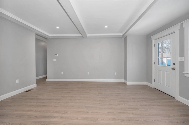 entrance foyer with crown molding and light wood-type flooring