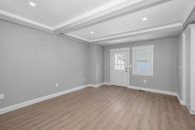 entrance foyer featuring crown molding and light hardwood / wood-style flooring