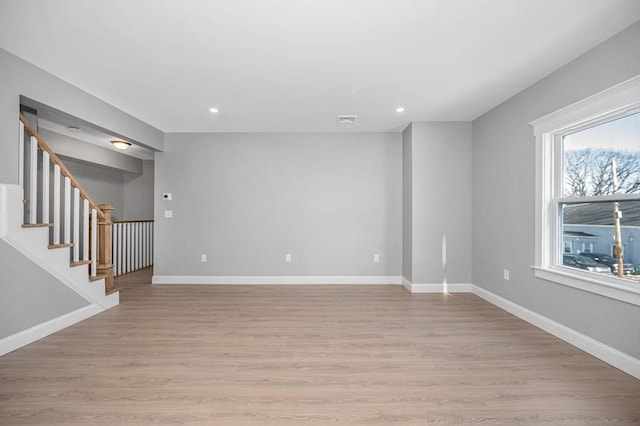 empty room with light hardwood / wood-style floors