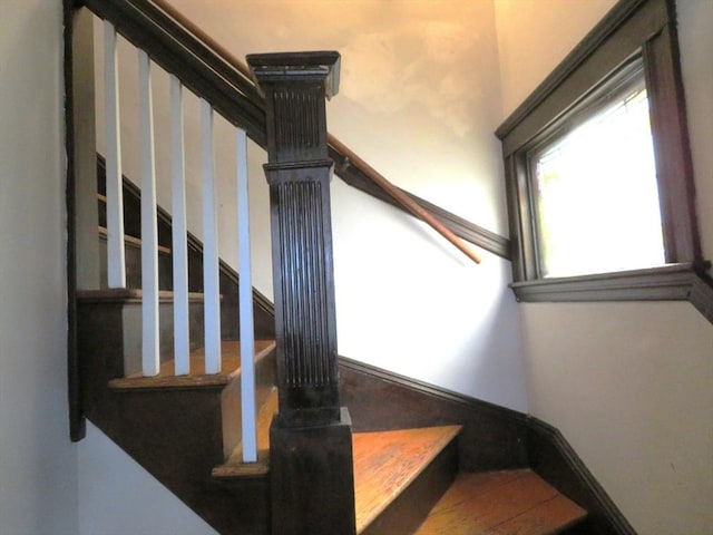 stairway featuring baseboards