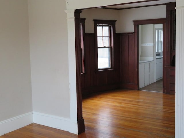 unfurnished room featuring light wood-style floors and baseboards