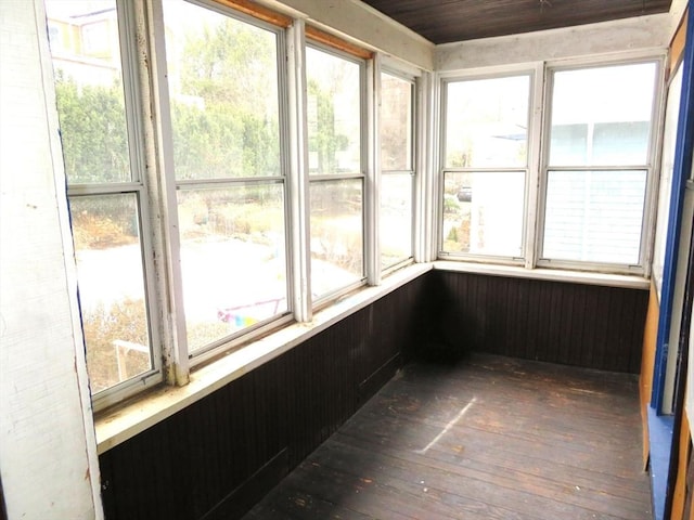 unfurnished sunroom with a wealth of natural light