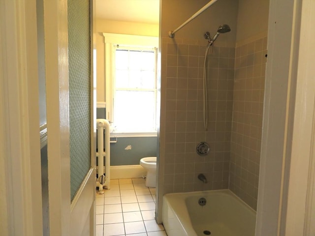 full bathroom featuring baseboards, toilet, radiator heating unit, tile patterned floors, and bathtub / shower combination