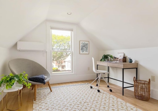 31 Kidder Ave Unit 31, Somerville, MA 02144 - home office featuring a wall mounted air conditioner, wood finished floors, and vaulted ceiling
