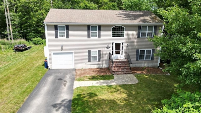 476 Upland St, New Bedford, MA 02745 - view of front of home with asphalt driveway, a front yard, and an attached garage