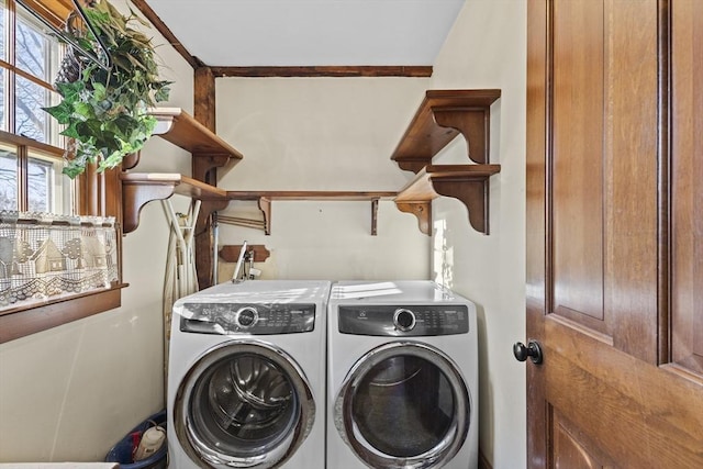 clothes washing area with independent washer and dryer