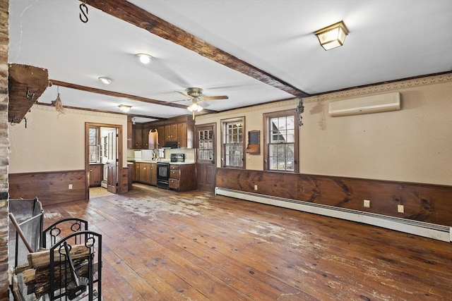 unfurnished living room featuring a baseboard radiator, light hardwood / wood-style floors, ceiling fan, a wall mounted air conditioner, and beamed ceiling