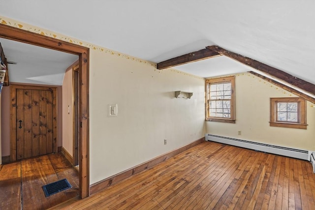 bonus room with baseboard heating, vaulted ceiling, and dark wood-type flooring